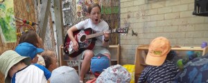 Playing guitar for nursery children